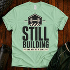 Still Building Fitness T-Shirt — 'Still Building One Rep At A Time' Gym Tee