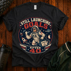 T-Shirt — "Still Launching Goals After 40" Astronaut Graphic Tee