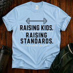 Raising Kids. Raising Standards. T‑Shirt — Funny Parenting Fitness Tee