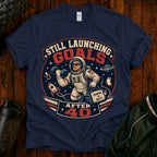 T-Shirt — "Still Launching Goals After 40" Astronaut Graphic Tee