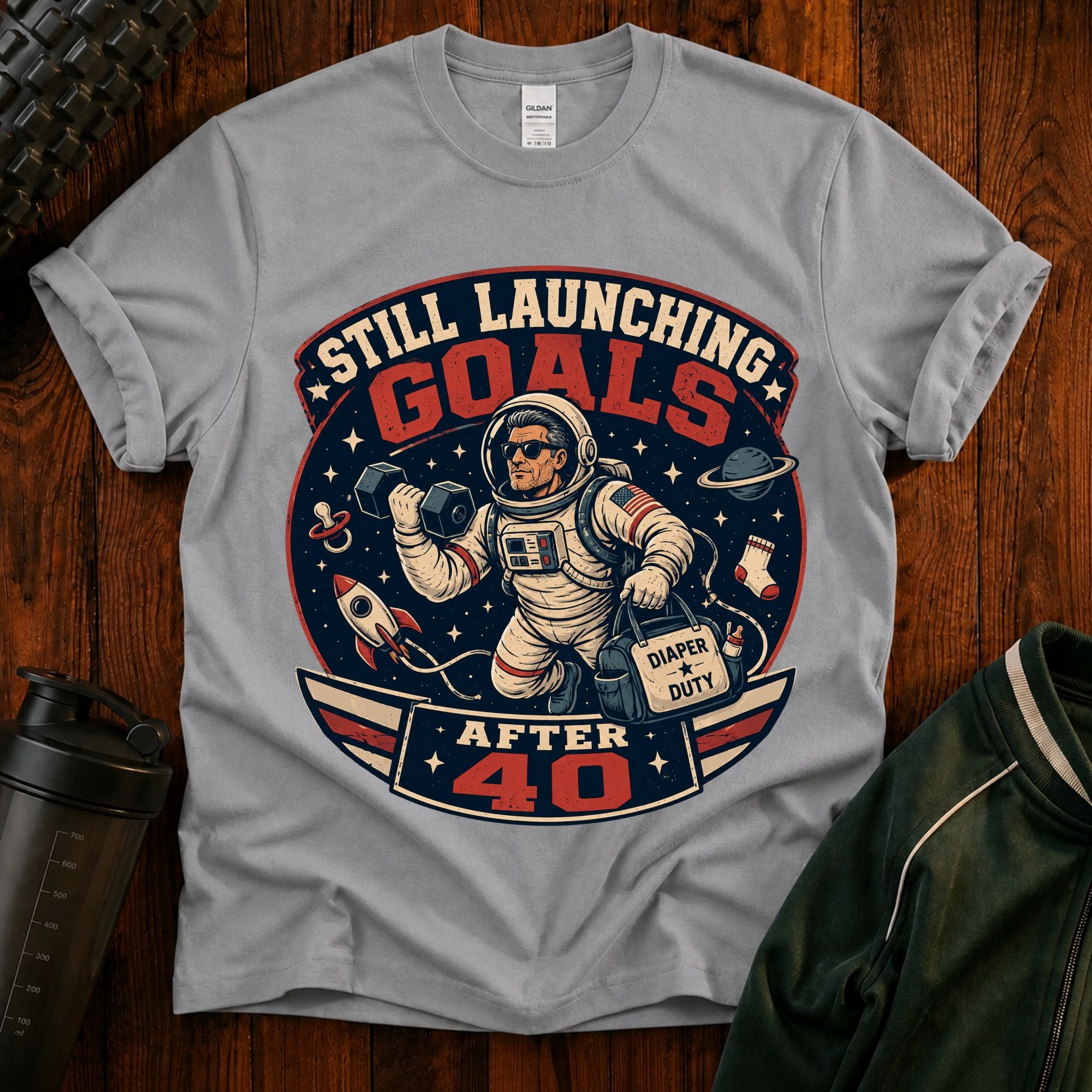 T-Shirt — "Still Launching Goals After 40" Astronaut Graphic Tee