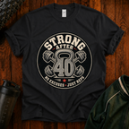 Strong After 40 graphic fitness shirt with kettlebell and dumbbells for active adults over 40.