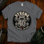 Strong After 40 graphic fitness shirt with kettlebell and dumbbells for active adults over 40.