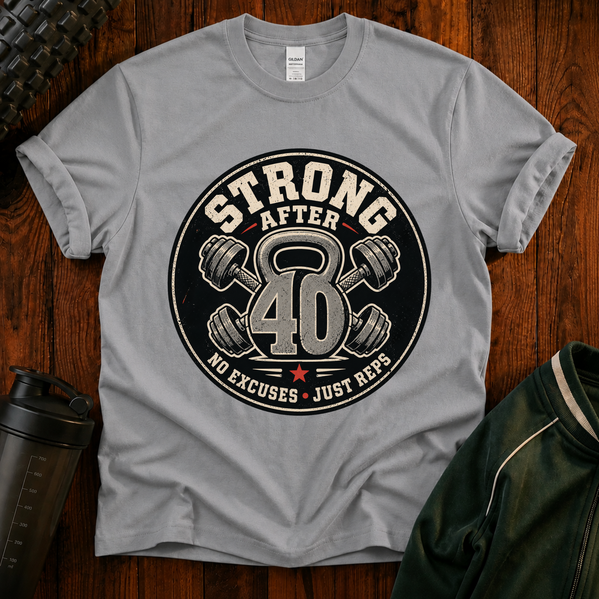 Strong After 40 graphic fitness shirt with kettlebell and dumbbells for active adults over 40.